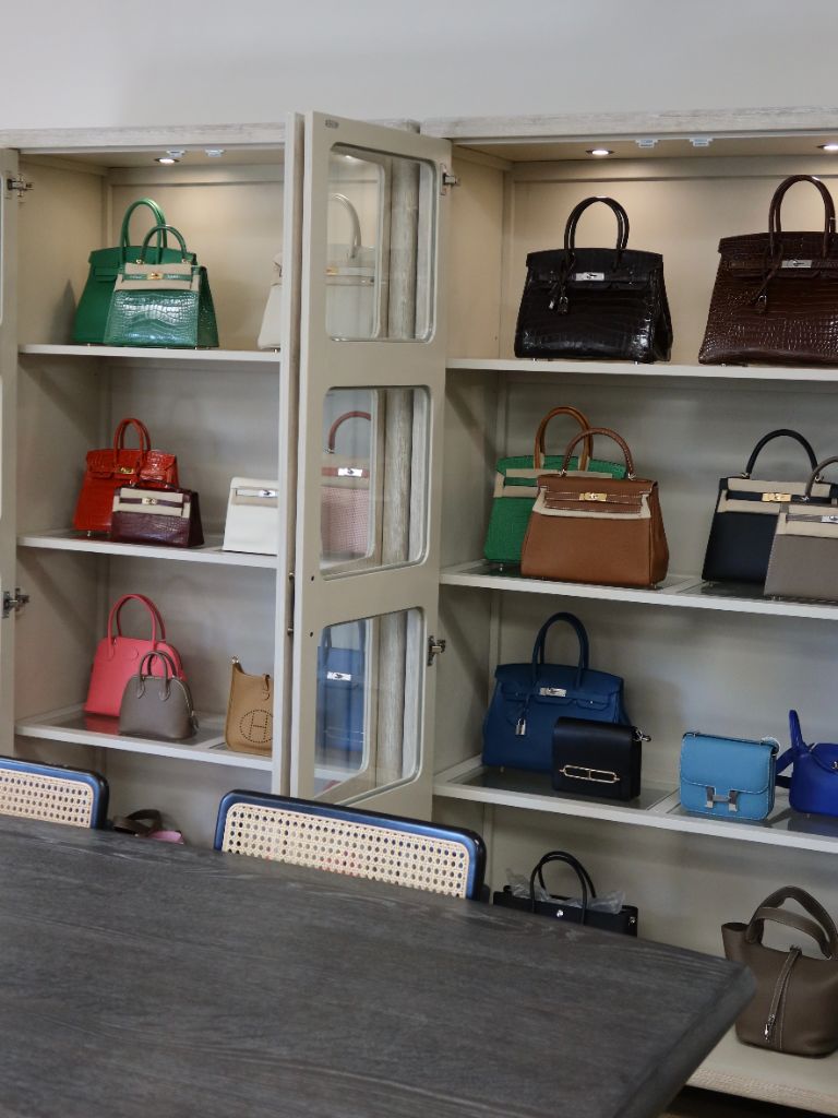 PERIMI luxury buyback showroom interior with curated handbag display